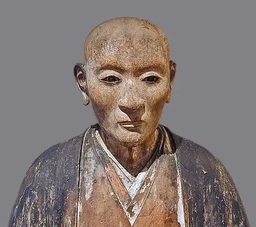 Portrait. Bois peint et laqué incrusté de cristal de roche (yeux). Début XVIIe&nbsp;siècle époque d'Edo. Japon.