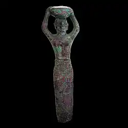 Figurine-clou de fondation d'Amar-Sin,roi d'Ur représentant le roi portant la corbeille du constructeur