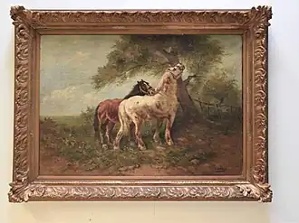 Chevaux près d'un arbre.