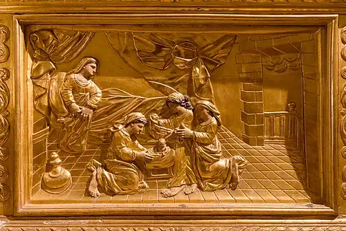 Panneau sculpté sur l'autel : la naissance de Marie.