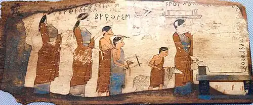 Plaque votive en bois provenant de la grotte de Pitsa (sanctuaire de Pan et des Nymphes) H. 15 cm, région de Corinthe, v. 540-530. Athènes MNArch.