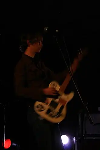 Guitarist with electric guitar by Sebastien.de-milleville.jpg