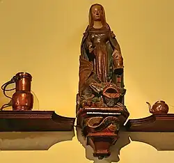 Statue de Sainte Marthe et la Tarasque, dans les cuisines de l'Hôtel-Dieu de Beaune (XVe&nbsp;siècle).