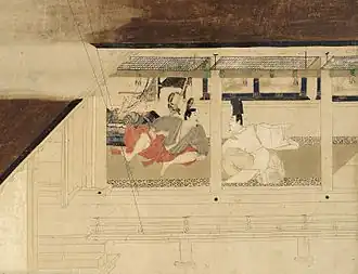 Deux hommes assis se font face, vus à travers les larges ouvertures d'une véranda.