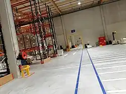 Grande porte coupe-feu entre les zones H et I à l’intérieur de l’entrepôt ID Logistics Bollène.