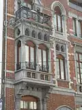 Maison personnelle d'Emile Hellemans - Maison bourgeoise et maison personnelle de l'architecte (rue Capitaine Crespel 23-25 à Ixelles, 1888) : style éclectique à dominante néogothique, avec sa magnifique logette en pierre (25) et renaissance (23);