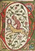 Lettrine enluminée D, représentant un homme sauvage chevauchant un cerf, Bible, Allemagne (1441-1449).