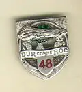 Insigne du 48e RI dur comme roc.