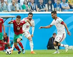 Harit après une récupération de ballon sur Alireza Jahanbakhsh.