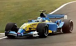 Photo d'une monoplace bleue et jaune en piste