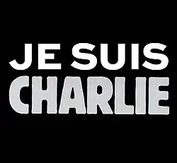 Texte « Je suis Charlie » écrit en blanc et gris sur un fond noir.