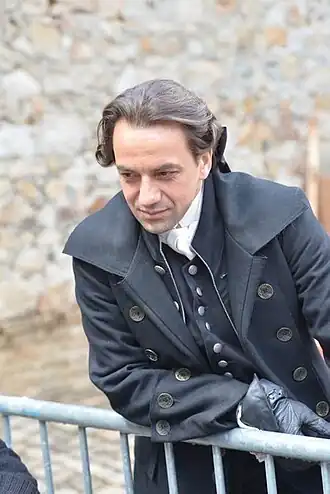 Jérôme Robart, interprète de Nicolas Le Floch, sur un tournage au Mans en 2014.
