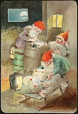 Dans une grange pleine de foin, des petits bonhommes à bonnet rouge préparent des paquets qu'ils chargent sur un traineau.