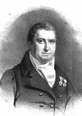 portrait ancien en noir et blanc d'un homme aux cheveux courts, habillé d'un ancien costume à large col sur lequel sont épinglées deux médailles