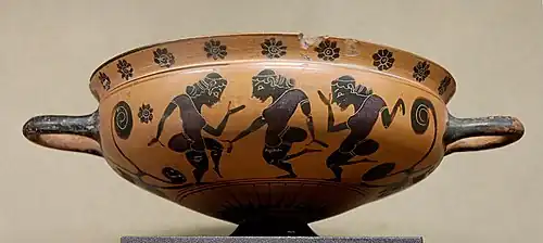 Coupe comaste attique à figures noires, vers -575/-565.