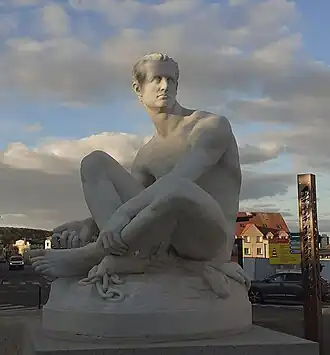 Exilé (1877), Louviers, place Ernest-Thorel.