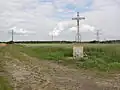 Paysage avec croix de chemin.