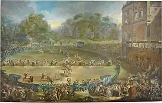 peinture : parade hippique royale dans un manège autour duquel s'attroupe le public venue en carrosses, ainsi que des musiciens (trompette et tambour) ; d'autres gens sont sur la terrasse d'un bâtiment.