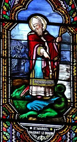 Dernier miracle : Marcel, devenu le 9e évêque de Paris, triomphe d'un dragon venu dévorer une noble matrone qui avait péché et, au moment où il sort de la forêt de Bièvre, il le maîtrise en le frappant trois fois avec son bâton pastoral.Le Bugue, église Saint-Sulpice.