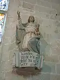 Statue anonyme, l'inscription gravée en caractère gothique sur la console du mur Est du bras Sud donne la date de début des travaux (6 juillet 1489)