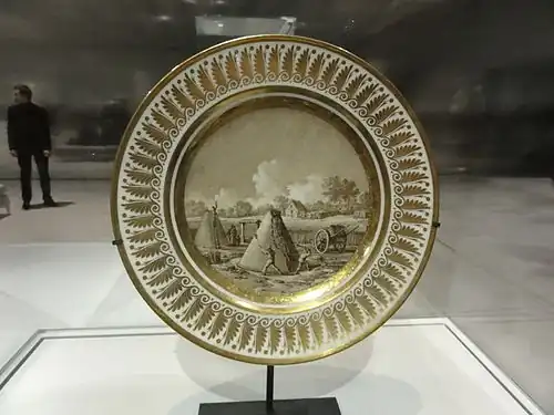 Assiette à dessert du service encyclopédique : Fabrique de charbon (1805-1806).Paris, musée du Louvre.