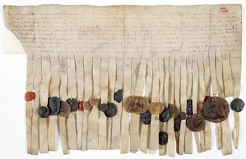 Charte par laquelle Henri III d'Angleterre et ses barons prennent Louis IX comme arbitre de leurs différends, scellée de 25 sceaux appendus sur queues de parchemin, 1263. Archives nationales AE-III-64.