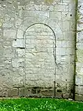 Base du clocher, porte bouchée côté ouest.