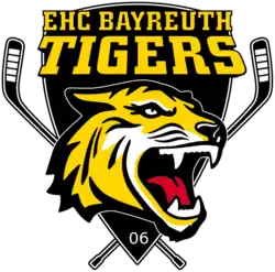 Logo représentant une tête de tigre devant deux crosses croisées et surmontée du texte "EHC BAYREUTH TIGERS"