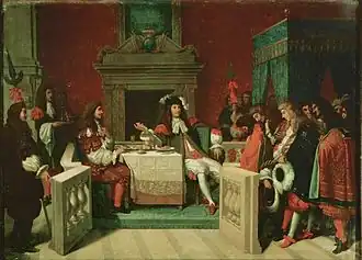 Molière et le roi attablé. Le roi parle aux courtisans, Molière regarde le roi.