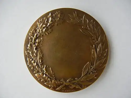 Revers d'une médaille en bronze.