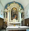 Le maître-retable, et deux des statues inscrites.