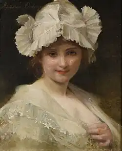 Jeune femme à la coiffe blanche.