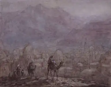 Cavaliers à dos de chameau dans les montagnes