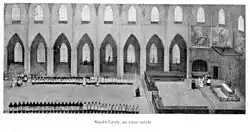 gravure représentant un groupe de religieux alignés dans des stalles à l'intérieur d'une église.