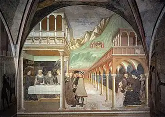 Tableau d'un banquet sous des colonnades avec une montagne dans le fond