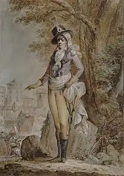 Représentation du général d'Elbée avec chapeau noir et cocarde, plumet et mouchoir de tête blancs, bandeau sur l'œil droit, veste rose à revers noirs, culotte blanche, bottes noires et écharpe blanche à la ceinture avec deux pistolets et un sabre. En arrière-plan figurent à droite un arbre et à gauche des murailles et des tours escaladées avec des échelles par des soldats républicains.