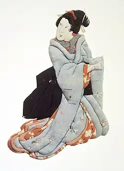 Oshi-e (estampe en découpes de tissus) représentant une geisha, XIXe&nbsp;siècle, Brooklyn Museum.