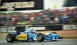 Photo d'une monoplace bleue et jaune en piste