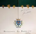Couverture d'un menu du restaurant daté de 1996, dédicacé par Johnny Hallyday.