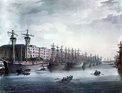 Le quai des Antilles&nbsp;(en) (West India Docks) en 1810. Les entrepôts furent construits à la demande des planteurs, négociants et armateurs négriers. Depuis 2003, le premier entrepôt abrite le London Museum Docklands et son exposition « Londres, sucre et esclavage ».