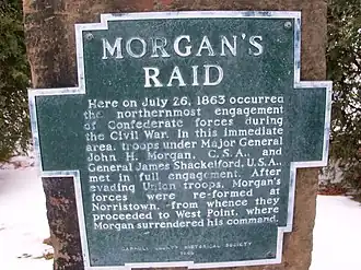 aluminum plaque bolted to sandstone. Plaque is shape of outline of Carroll County, Ohio, with raised letters that read&nbsp;: MORGAN'S RAID Here on July 26, 1863 occurred the northernmost engagement of Confederate forces during the Civil War. In this immediate area, troops under Major General John H. Morgan, C.S.A., and General James Shackleford, U.S.A., met in full engagement. After evading Union troops, Morgan's forces were re-formed at Norristown, from whence they proceeded to West Point, where Morgan surrendered his command.  CARROLL COUNTY HISTORICAL SOCIETY 1969