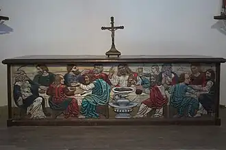 Antependium en bois sculpté peint représentant la Cène.