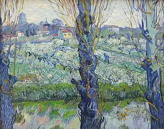 Vincent van Gogh, Verger en fleur avec vue d'Arles (1888).