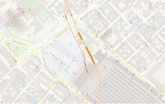 Plan en couleurs sur lequel est reporté le tracé d'un mur.