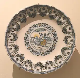 Assiette circulaire, Apollon et Daphné.