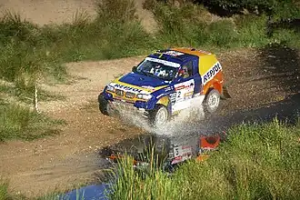 Nani Roma en 2009, avec comme copilote le français Michel Périn, sur BMW X3/Repsol.