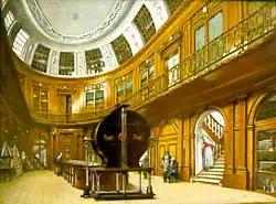 Au premier plan de la « Salle ovale » du Musée des Sciences et des Arts de Haarlem, vers 1784, la machine de Van Marum à plateaux géants pour des démonstrations publiques de Science électrique du Siècle des Lumières