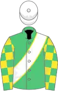 Emerald green, white sash with yellow piping, emerald green and yellow check sleeves, white cap with pom pom