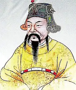 Dessin de portrait d'un homme chinois barbu regardant vers la gauche, habillé d'une robe souple jaune et ayant un chapeau de général.
