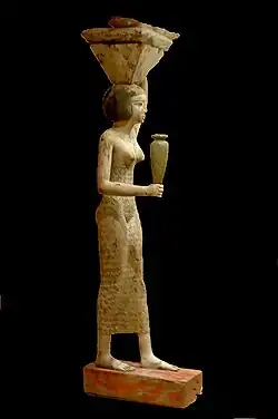 Porteuse d’offrandes, vers -1950, début XIIe dynastie, bois de ficus enduit et peint (Musée du Louvre).